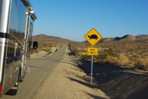 Rv, traveling down desrt road