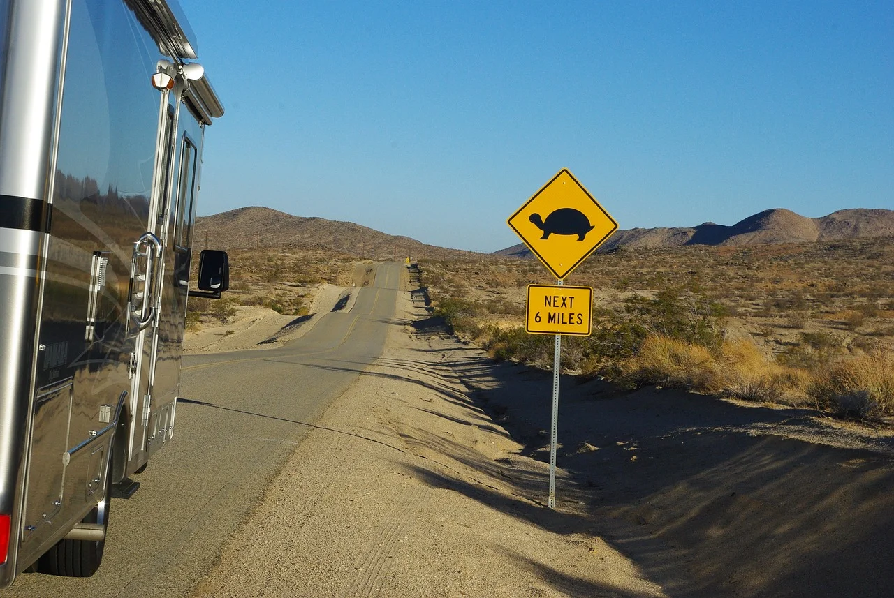 Rv, traveling down desrt road